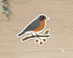 American Robin die-cut vinyl sticker perched on a botanical berry branch