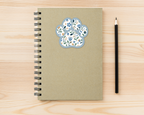 Bluebell Floral Paw Print Sticker on a spiral notebook