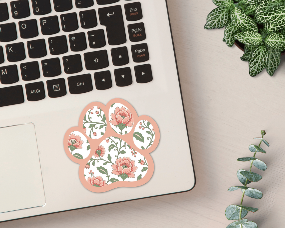 Blush Meadow Floral Paw Print Sticker on a laptop