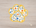 Goldenrod Floral Paw Print Sticker with yellow border and blue orange floral pattern