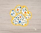 Goldenrod Floral Paw Print Sticker with yellow border and blue orange floral pattern