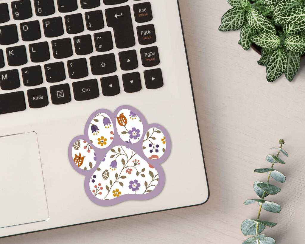 Heather Floral Paw Print Sticker on a laptop