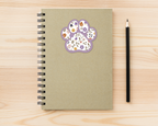 Heather Floral Paw Print Sticker on a spiral notebook
