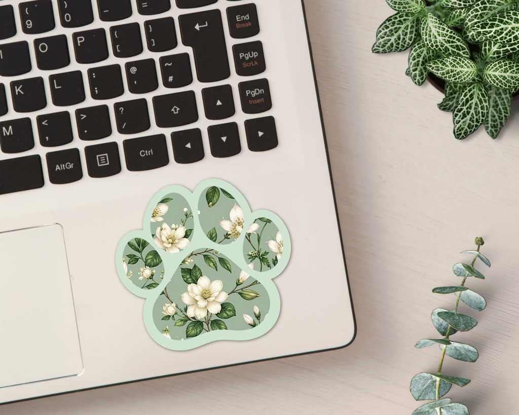 Magnolia Sage Floral Paw Print Sticker on a laptop