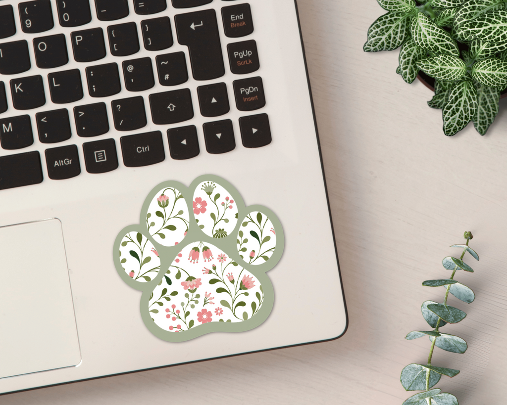 Sage Garden Floral Paw Print Sticker on a laptop