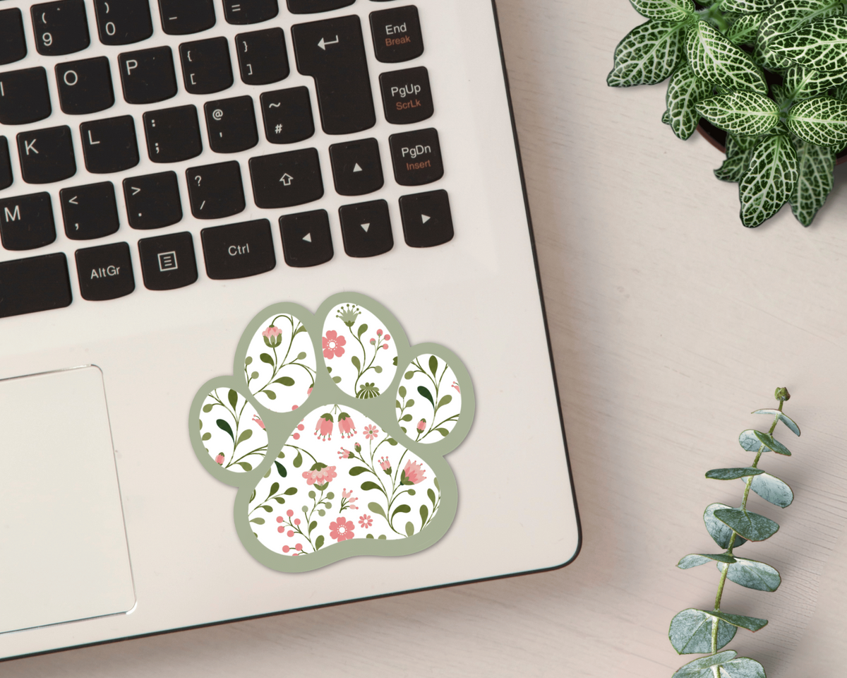 Sage Garden Floral Paw Print Sticker on a laptop