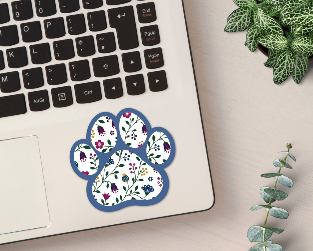 Sapphire Floral Paw Print Sticker on a laptop