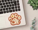 Terracotta Bloom Floral Paw Print Sticker on a laptop