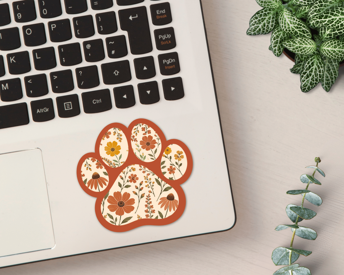 Terracotta Bloom Floral Paw Print Sticker on a laptop