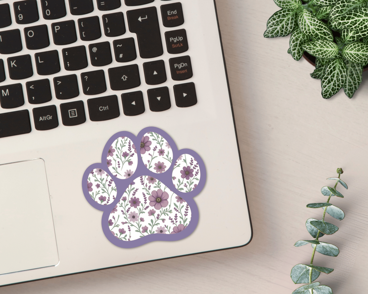 Violet Garden Floral Paw Print Sticker on a laptop